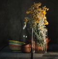 Closeup shot of a vase of wildflowers on a table Royalty Free Stock Photo