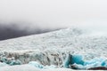 Closeup shot of Vatnajokul glacier with all the details, texture and pattern. Black ash covers the ice. Foggy and rainy weather Royalty Free Stock Photo