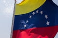 Closeup shot of Venezuela flag on a blue sky