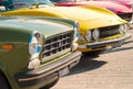Closeup shot of vintage cars at the exhibition near the sea shore in Pesaro, Italy