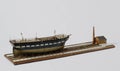 Closeup shot of a vintage figurine of a ship isolated on a white background