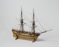 Closeup shot of a vintage figurine of a ship isolated on a white background