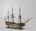 Closeup shot of a vintage figurine of a ship isolated on a white background