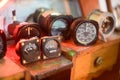 Closeup shot of vintage gauges with red neon lights behind them