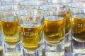 Closeup shot of vodka glasses filled with mead beverage in the Hvar city of Croatia Royalty Free Stock Photo