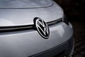 Closeup shot of the Volkswagen car logo on the front of the vehicle.
