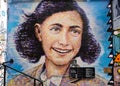 Closeup shot of a wall with graffiti of Anne Frank, Berlin, Germany