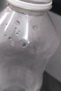 A closeup shot of water drops and dew inside a plastic water bottle