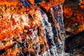 Closeup shot of the water pouring through the rocks Royalty Free Stock Photo