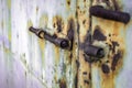 Closeup shot of a weathered old door with a rusty lock Royalty Free Stock Photo