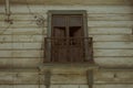 Closeup shot of a weathered rural house balcony and windows Royalty Free Stock Photo