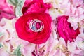 Closeup shot of wedding rings on a beautiful flower composition at a wedding ceremony Royalty Free Stock Photo