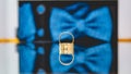Closeup shot of a wedding rings with blue bow tie background Royalty Free Stock Photo