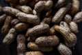 Closeup shot of wet peanuts shell group isolated on floor