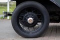 Closeup shot of the wheel of an old black car Royalty Free Stock Photo