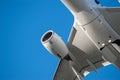 Closeup shot of a white airplane under the blue sky Royalty Free Stock Photo