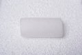 Closeup shot of a white box filler in the middle of a styrofoam board Royalty Free Stock Photo