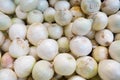 Closeup shot of white onions in a market under the lights - perfect for food concepts Royalty Free Stock Photo