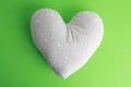 Closeup shot of a white pillow in a heart shape Royalty Free Stock Photo