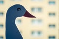 Closeup shot of a white swan figure by the window on a blurred background Royalty Free Stock Photo