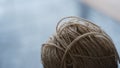 Closeup shot of the white woolen yarn ball Royalty Free Stock Photo