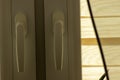 Closeup shot of a window handle with blinds in soft light Royalty Free Stock Photo
