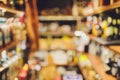 Closeup shot of wine shelf. Bottles lay over straw. Wine cellar. blurred.