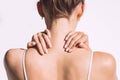 Woman from back having neck or shoulder pain. Injury or muscle spasm. Royalty Free Stock Photo