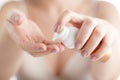 Closeup shot of woman hands applying moisturizing hand cream Royalty Free Stock Photo