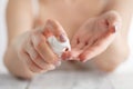 Closeup shot of woman hands applying moisturizing hand cream Royalty Free Stock Photo