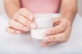 Closeup shot of woman hands applying moisturizing hand cream Royalty Free Stock Photo