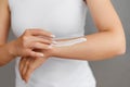 Closeup shot of woman hands holding cream and applying moisturizing hand cream. Beautiful female hands with cream. Hand Skin Care Royalty Free Stock Photo