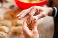 Closeup shot of woman hands making sauerkraut dumplings