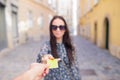 Closeup shot of a woman passing a payment credit card. Royalty Free Stock Photo