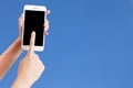 Closeup shot of a woman typing on mobile phone