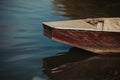 Closeup shot of a wooden boat edge on a lake