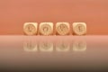 Closeup shot of wooden dices with love letters and reflected hate letters Royalty Free Stock Photo