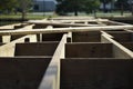 Closeup shot of wooden flooring house base under construction Royalty Free Stock Photo