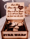 Closeup shot of a wooden guest wish box full of hearts for a wedding celebration