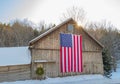 Closeup shot of a wooden house with an American flag in Vermont, USA Royalty Free Stock Photo