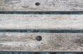 Closeup shot of a wooden pier path with visible water surface under it