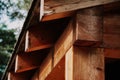 Closeup shot of wooden roof sheathing (roof overhang) on a blurred background