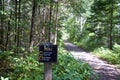 Closeup shot of a wooden signpost of the Old Railway Bike Trail in Ontario, Canada Royalty Free Stock Photo