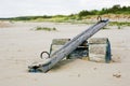 Closeup shot of a wooden teeter totter in the beach