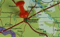 Closeup shot of a world map with a red pushpin pointing the city of Roslavl in Russia Royalty Free Stock Photo