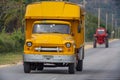 Closeup shot of a yellow truck in a street of Santiago de Cuba