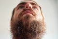 Closeup shot of a young attractive man with blue eyes and a beard Royalty Free Stock Photo