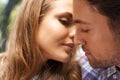 Feeling the romance. Closeup shot of a young couple sharing a tender moment while enjoying a day outside. Royalty Free Stock Photo