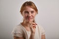 Portrait of young girl with ginger hair dressed in casual white blouse Royalty Free Stock Photo