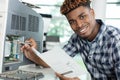 closeup shot young male technician repairing digital photocopier machine Royalty Free Stock Photo